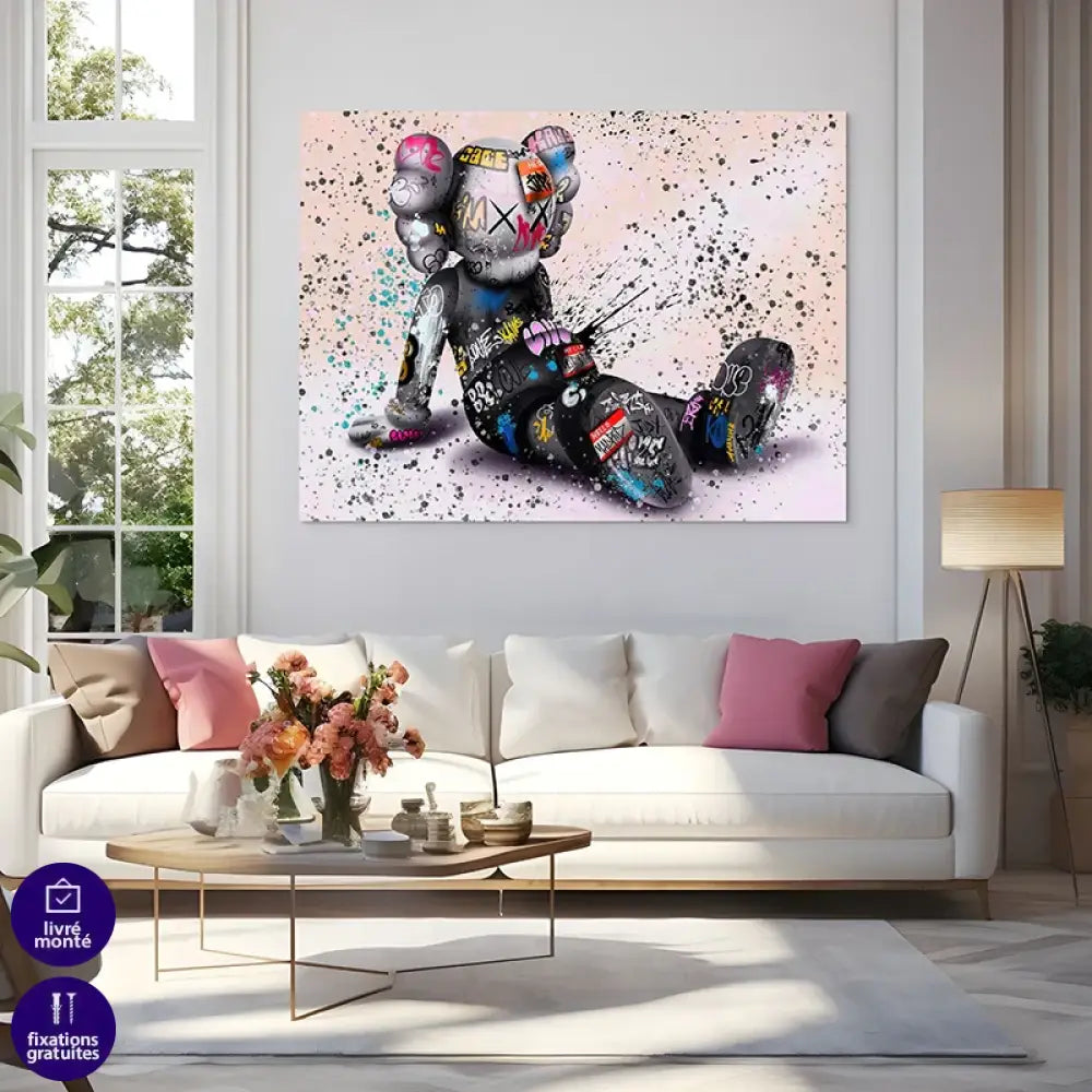 tableau kaws personnage assis style street art pour salon ou bureau