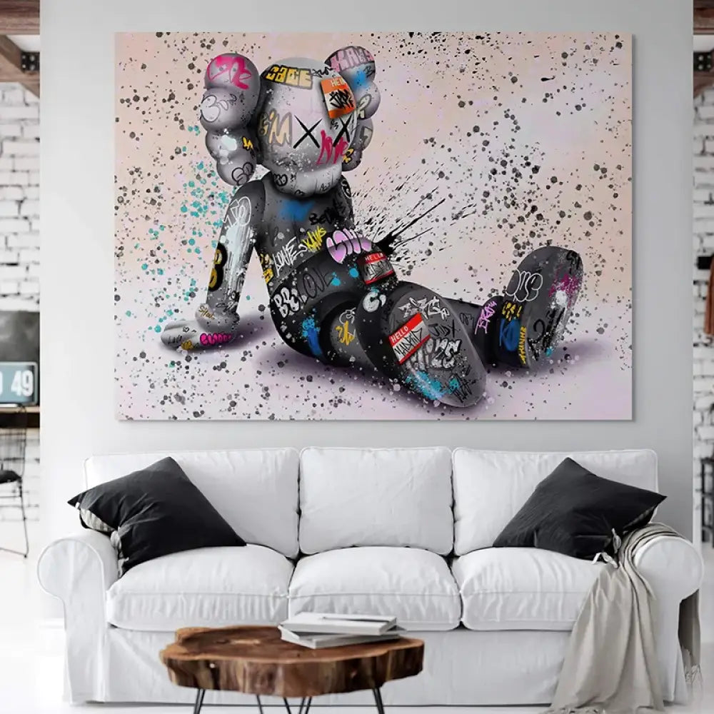 tableau kaws le rêveur assis street art personnage assis tags et éclaboussures