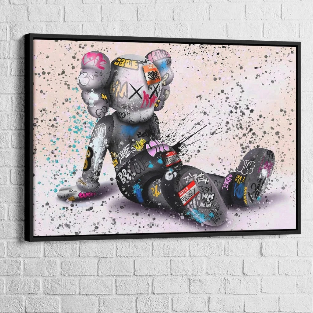 tableau kaws le rêveur assis avec cadre noir 